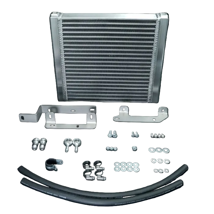 Car radiator kit with brackets and hoses on a black background