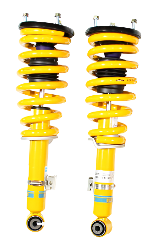 Pair of yellow shock absorbers on a white background