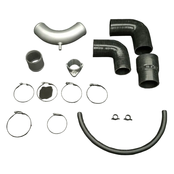 Collection of automotive intake components on a dark background
