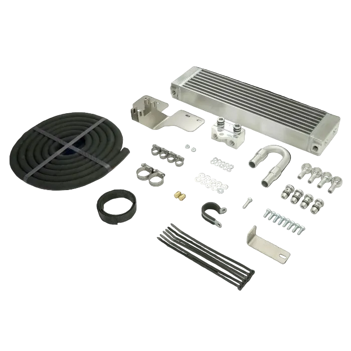 Collection of automotive parts including a radiator, hoses, and brackets on a dark background