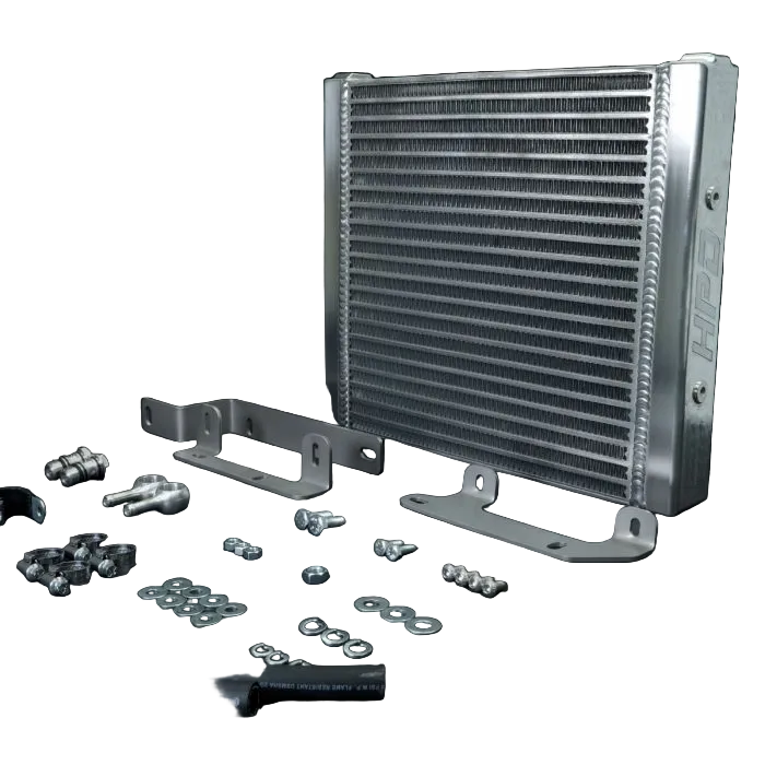 Aluminum radiator with mounting brackets and screws on a black background