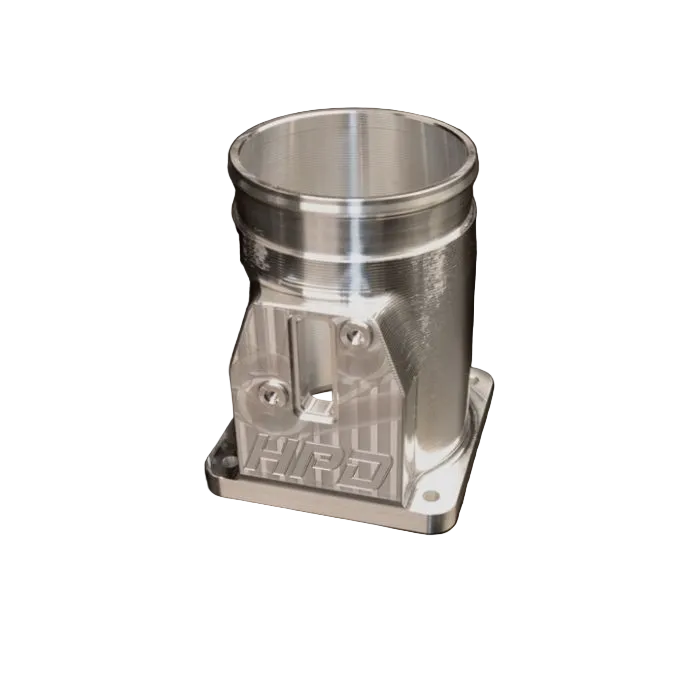 Metallic engine piston on a black background